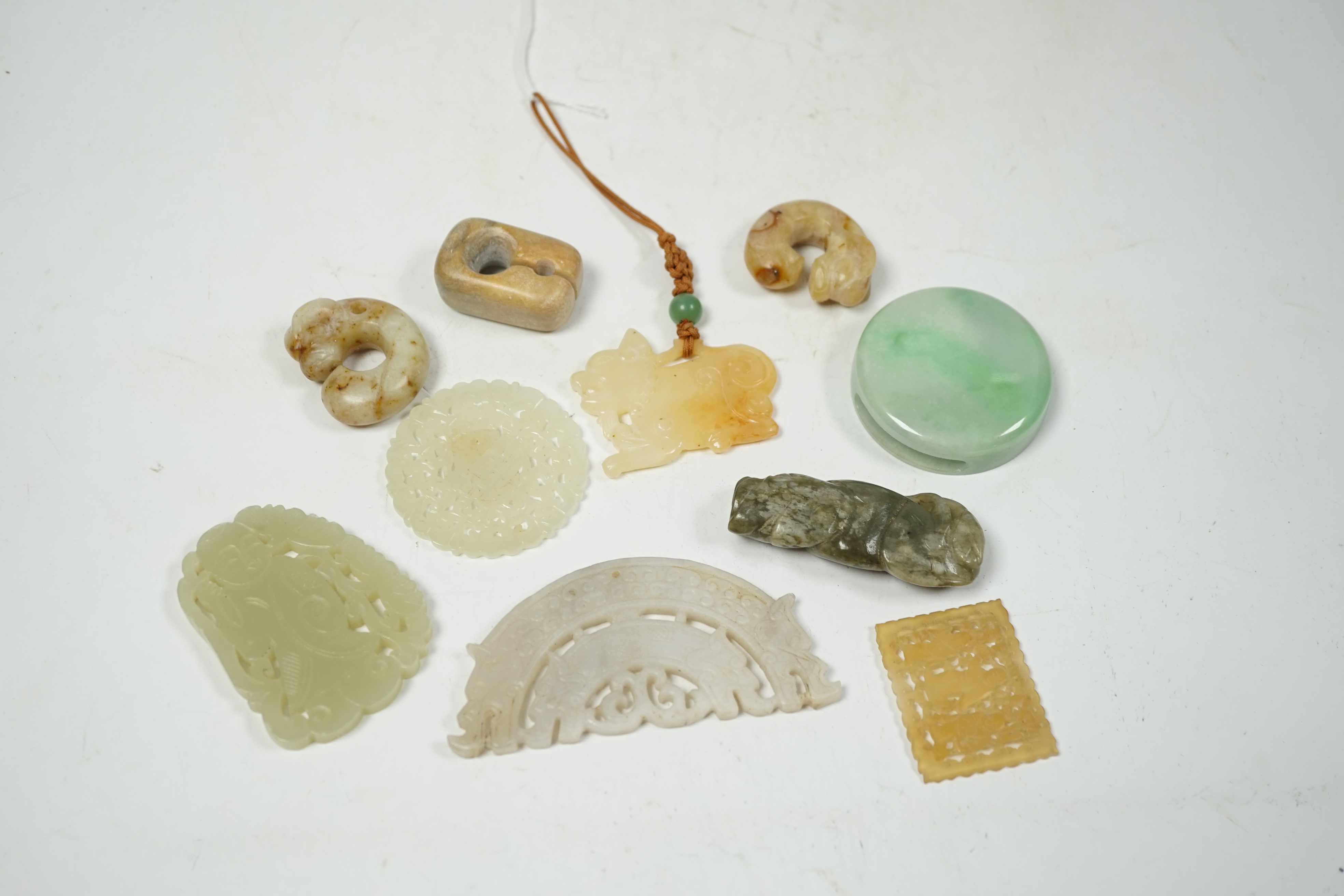 Four Chinese jade plaques or pendants, five other various jade or hardstone carvings, 19th/20th century largest 9cm wide